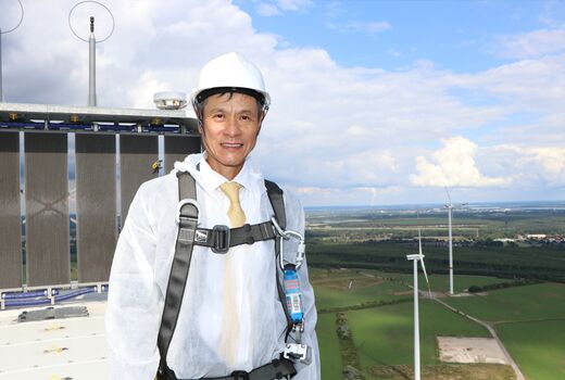 Man standing on wind turbine - wind farm Klettwitz